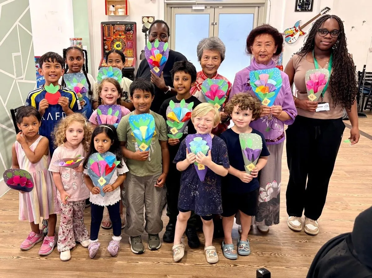 Children making paper flower bouquets at the Chinese Stories Arts and Crafts workshop
