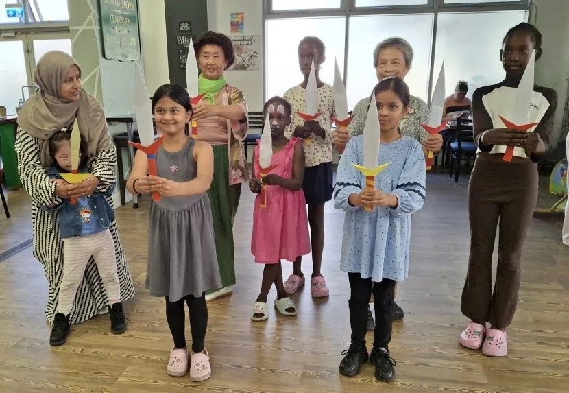 Children making card swords and learning the Chinese Sword Dance