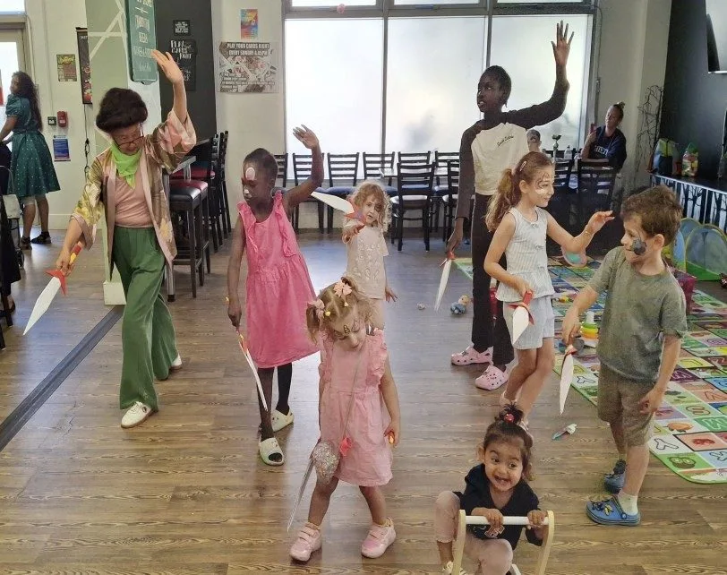 Children making card swords and learning the Chinese Sword Dance
