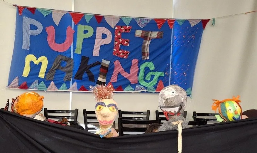 Children making puppets and putting on puppet shows