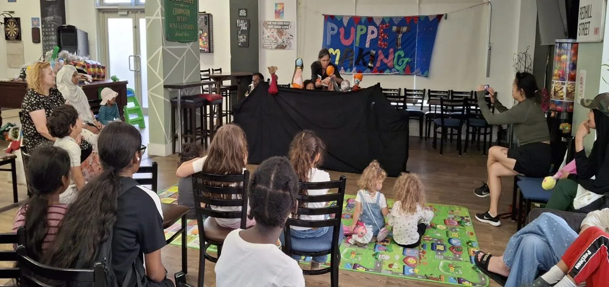 Children making puppets and putting on puppet shows