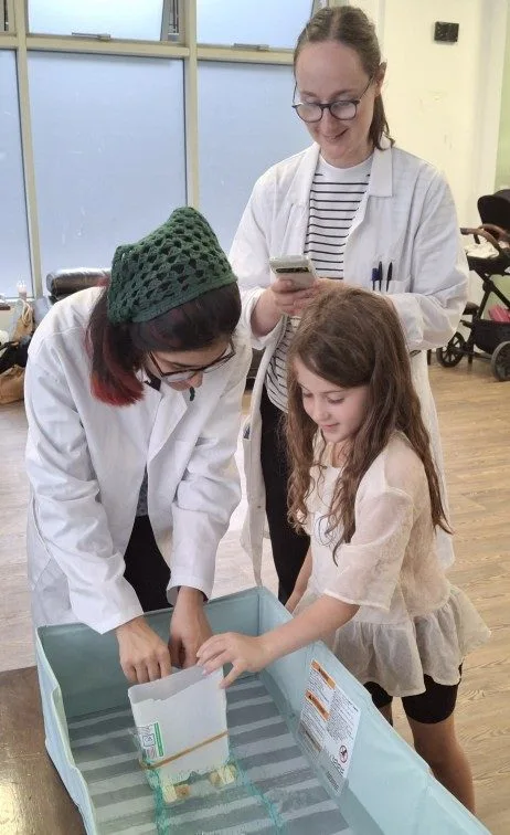 Children taking part in Science Owl hands-on science workshops