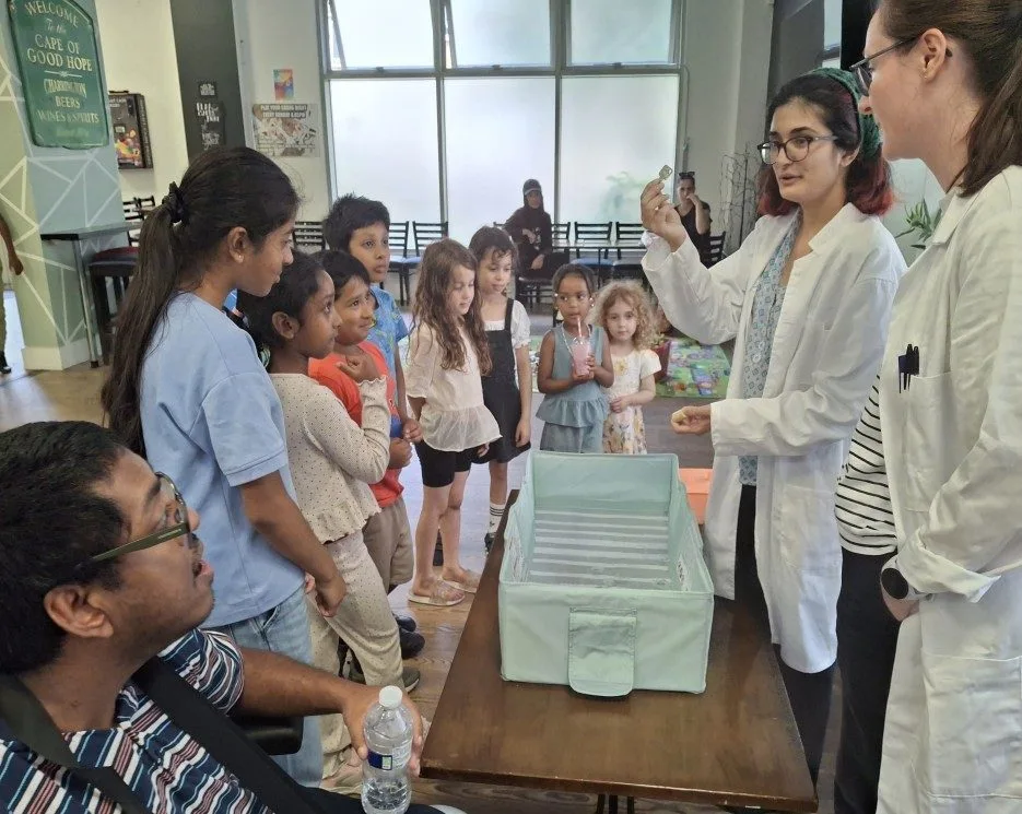 Children taking part in Science Owl hands-on science workshops