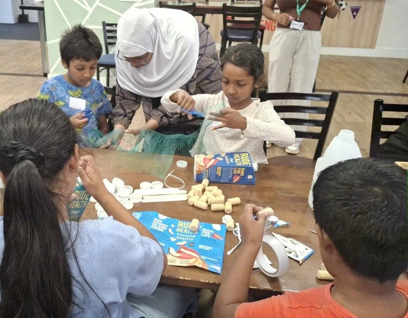 Children taking part in Science Owl hands-on science workshops