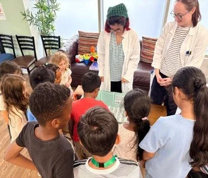 Children taking part in Science Owl hands-on science workshops